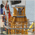 Демонтаж башенного крана 'Либхер'. Строительство основания буровых платформ по проекту 'Сахалин-2' в порту Восточный.